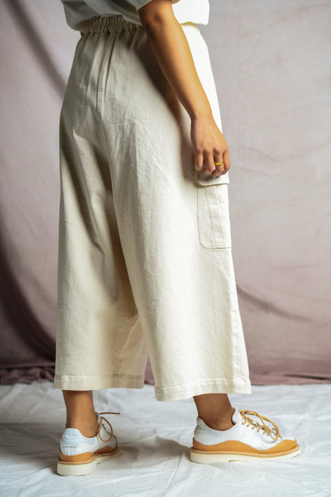 Rear view of person wearing Mónica Cordera Chunky Cotton Pocket Pants