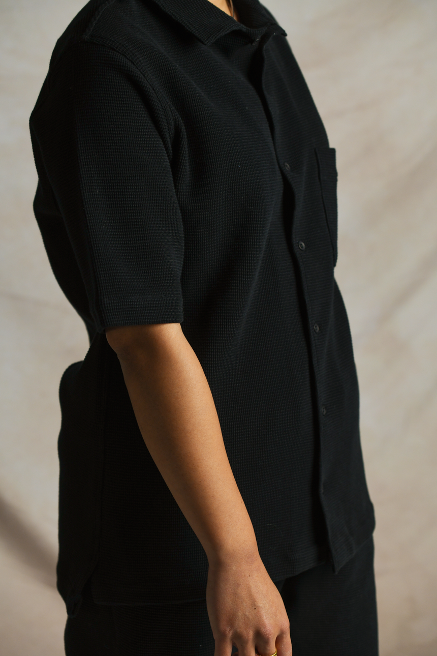 Side arm details of OFTT Waffle Shirt in black. 